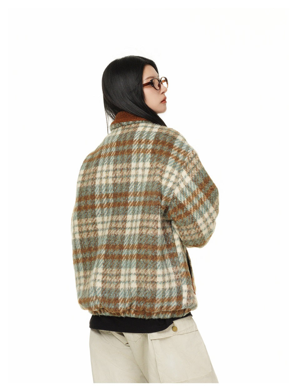 Model wearing a brown, cream and muted teal plaid jacket, shown from the side and back.