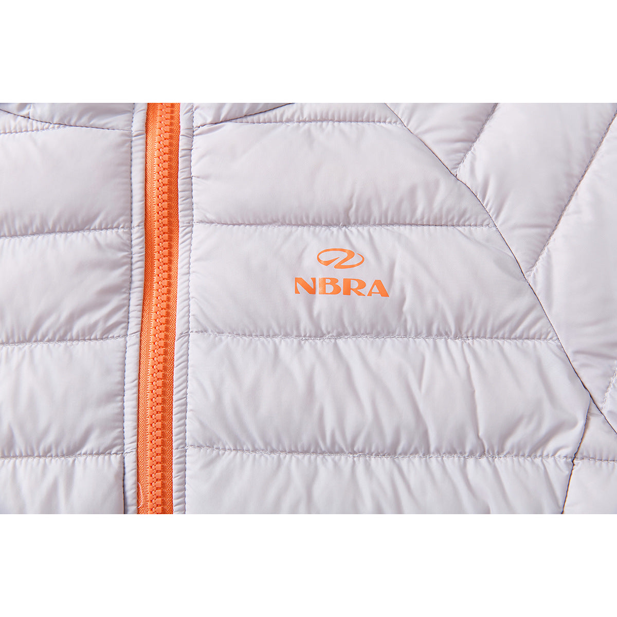 Close-up of a pale lavender quilted jacket with an orange zipper and orange NBRA chest logo.