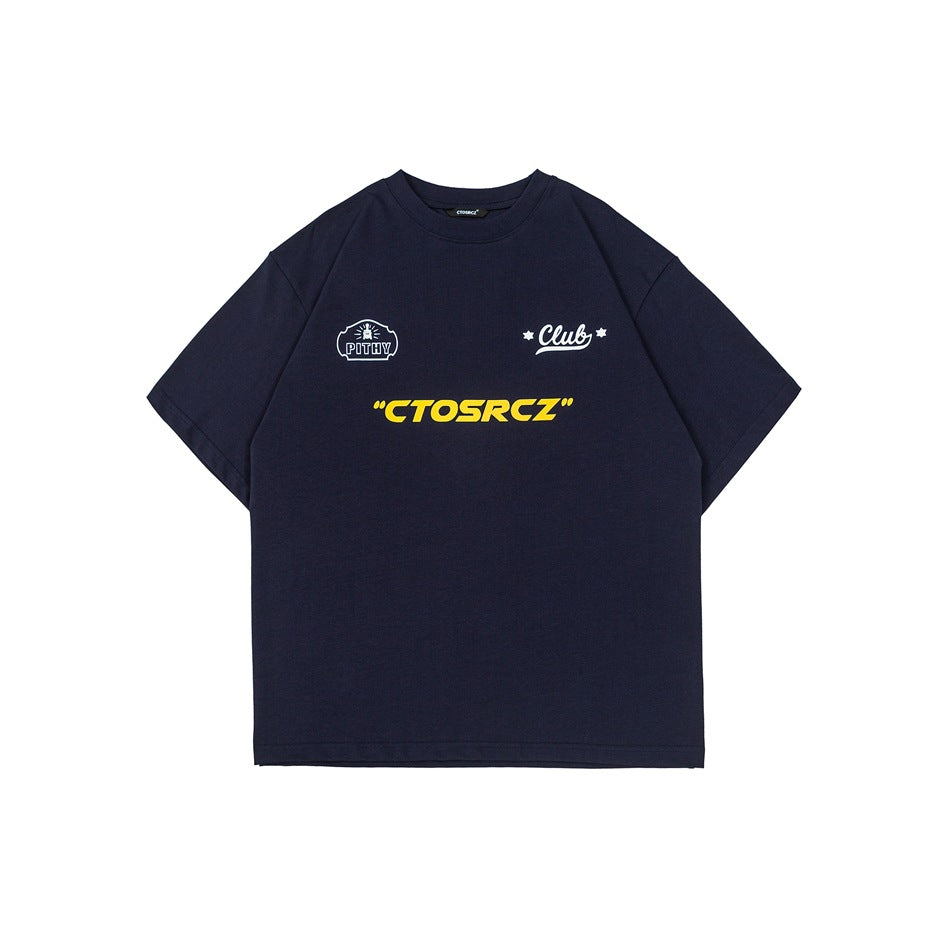 Navy short-sleeve crew-neck T-shirt with yellow chest wordmark, white badge graphic and script Club graphic, flat front view