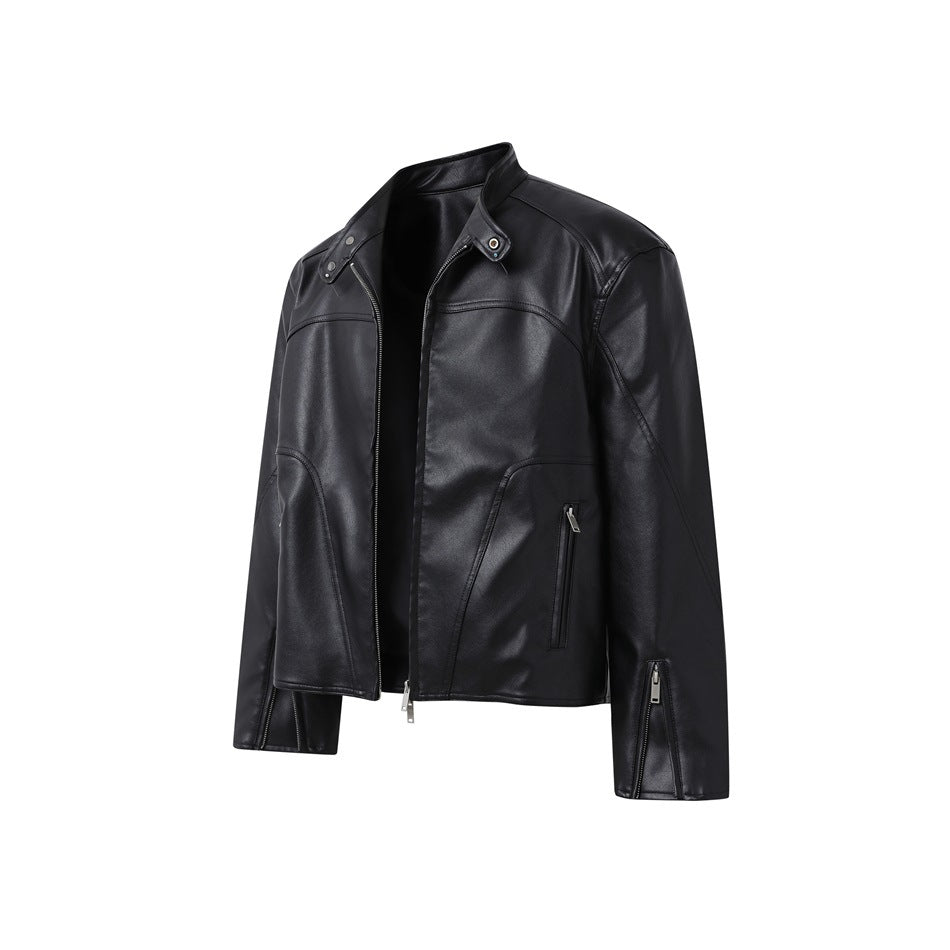 Front view of a black jacket with a stand collar, asymmetrical zip closure, and zippered pockets.