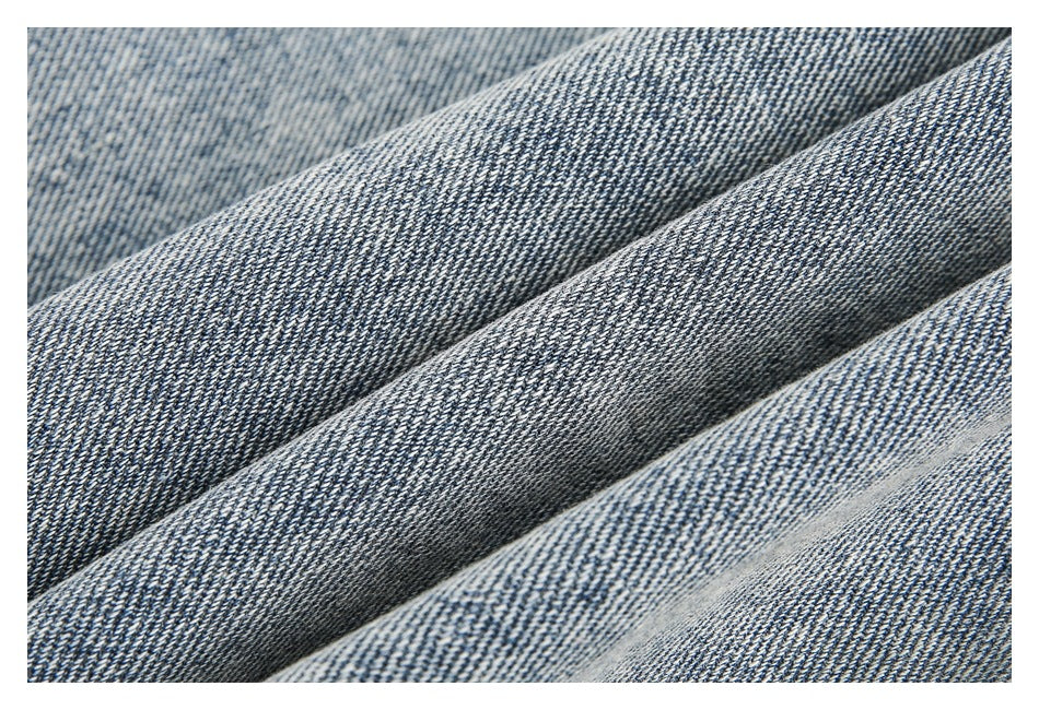 Close-up showing the diagonal weave and blue-and-white texture of denim.