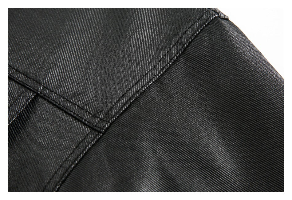 Close-up of the black jacket’s shoulder seam and textured fabric.
