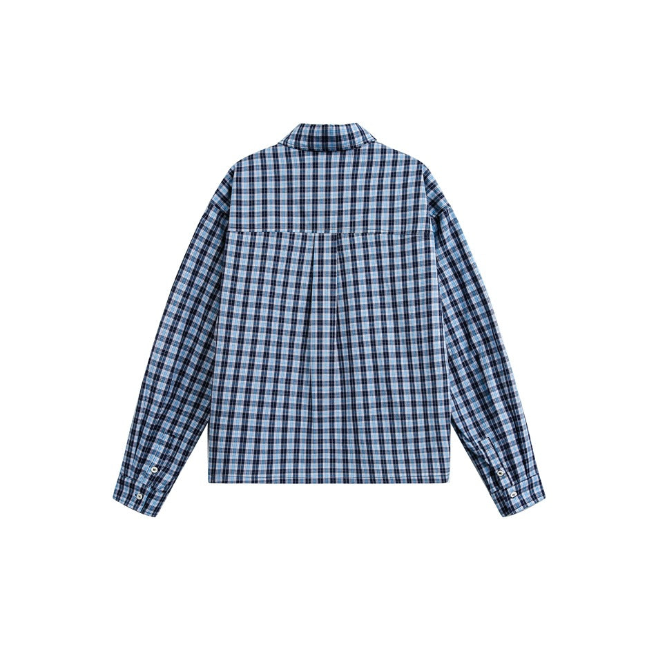 Back view of a blue, black, and white plaid long-sleeve button-up shirt laid flat.