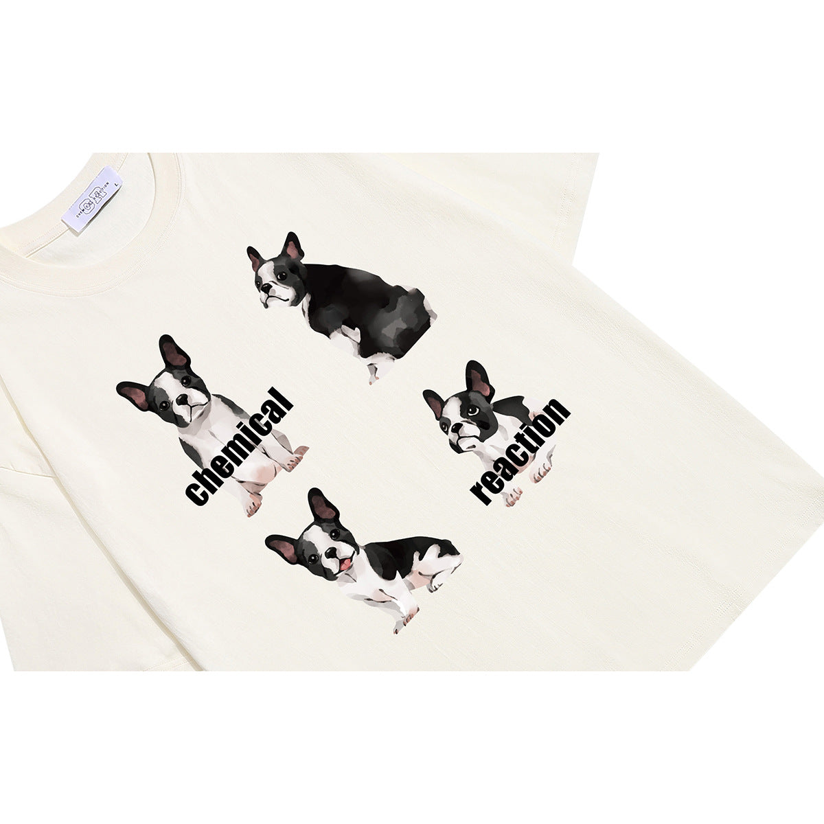 Angled close-up of an off-white T-shirt printed with four black-and-white dogs and the words “chemical reaction.”