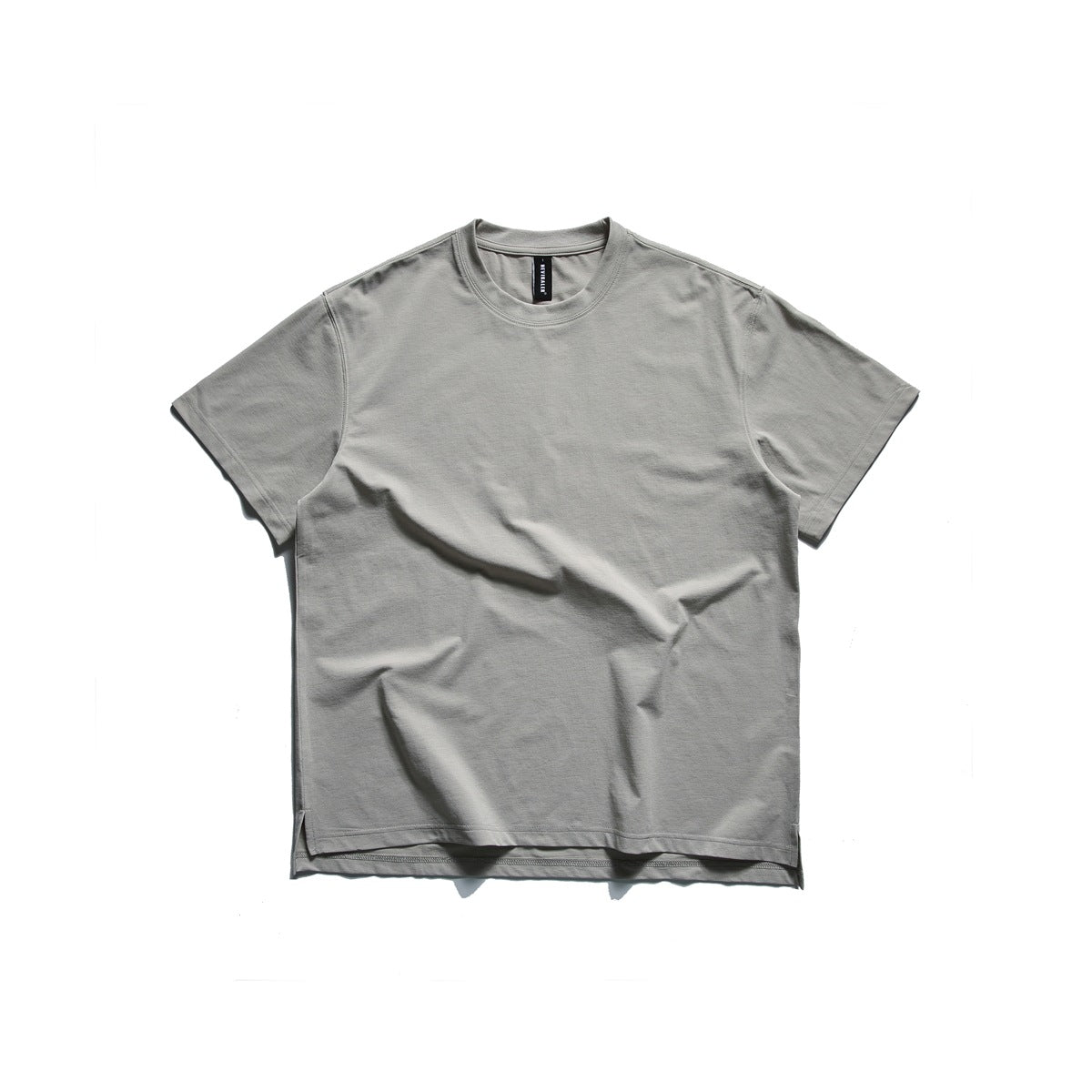 Beige gray short-sleeve crew neck T-shirt laid flat, front view, with side hem slits