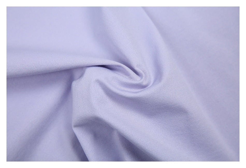 Close-up of softly folded lavender fabric showing its smooth surface.