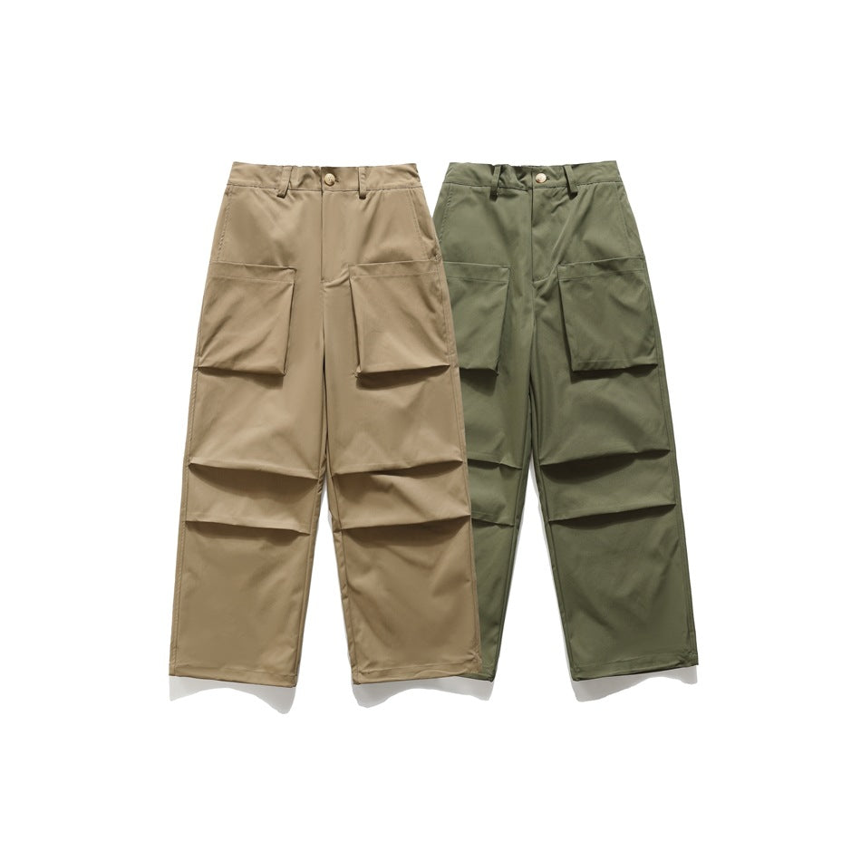 Two pairs of wide-leg cargo pants shown from the front in tan and olive, each with large flap pockets.