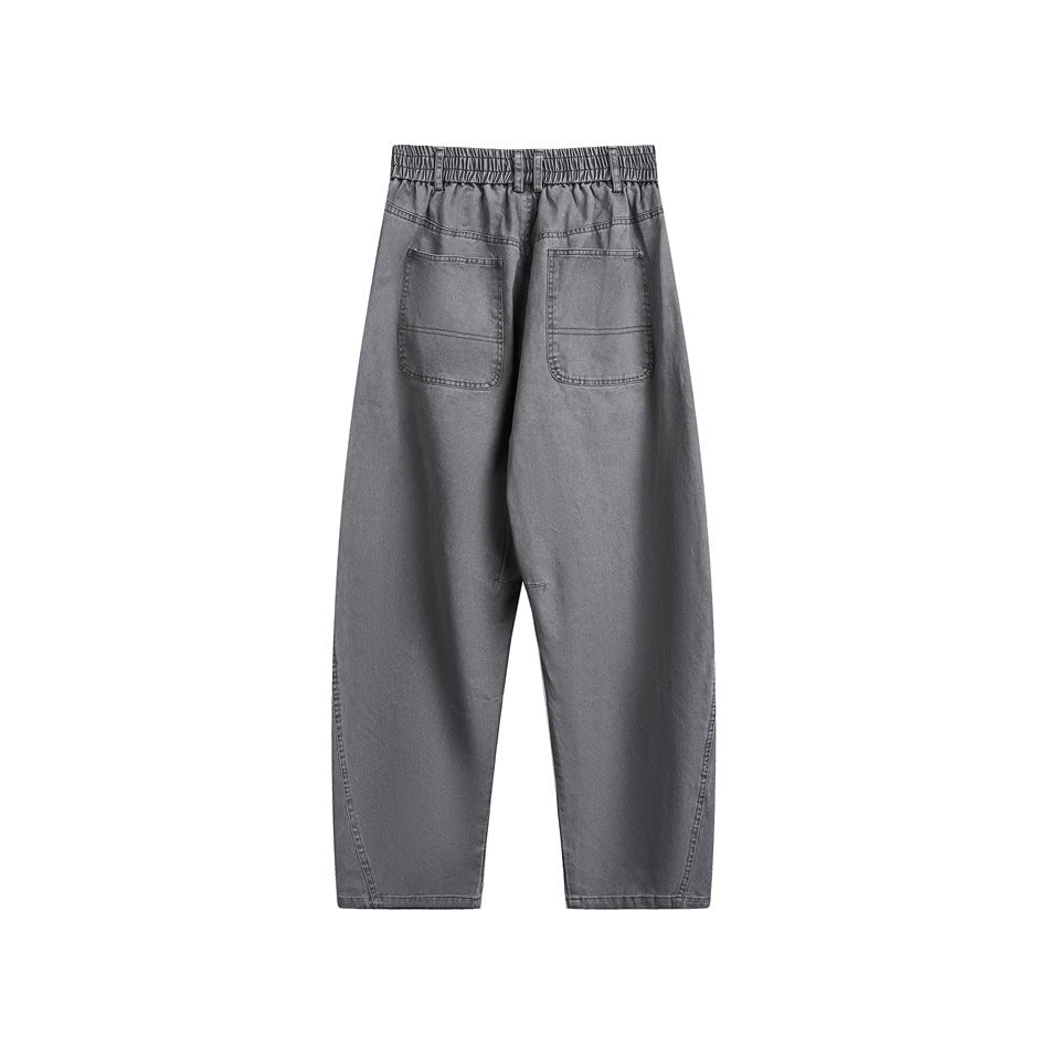 Back view of gray wide-leg pants with elastic waistband and two patch pockets with topstitching