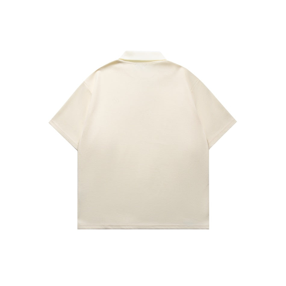 Back view of an ivory short-sleeve polo shirt with a plain body and ribbed collar.