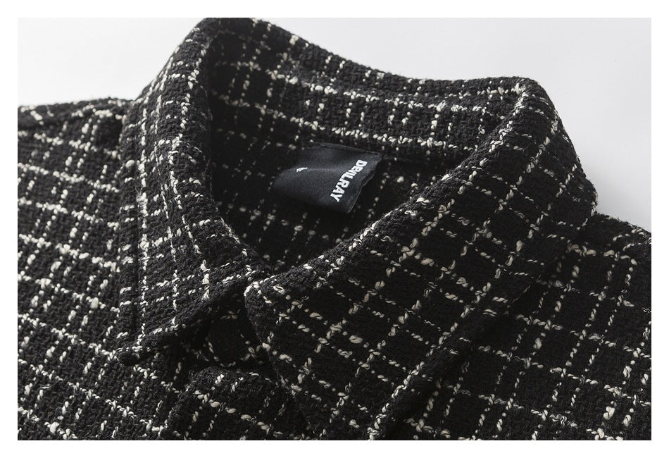 Close-up of the plaid shirt jacket's collar and inner neck label.