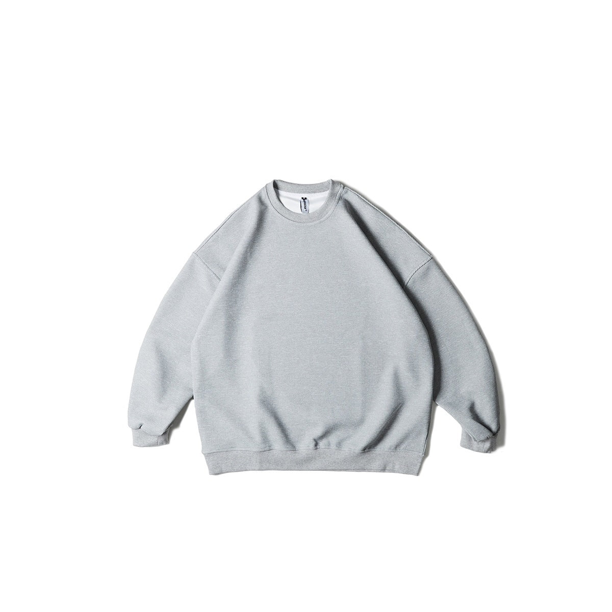 Heather gray crew neck sweatshirt with drop shoulders and ribbed cuffs and hem, flat lay front view