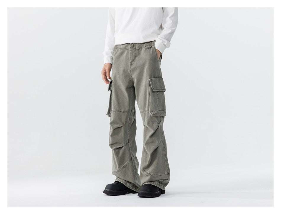 Model wearing green washed wide-leg cargo pants with a white top, three-quarter side view with flap pockets