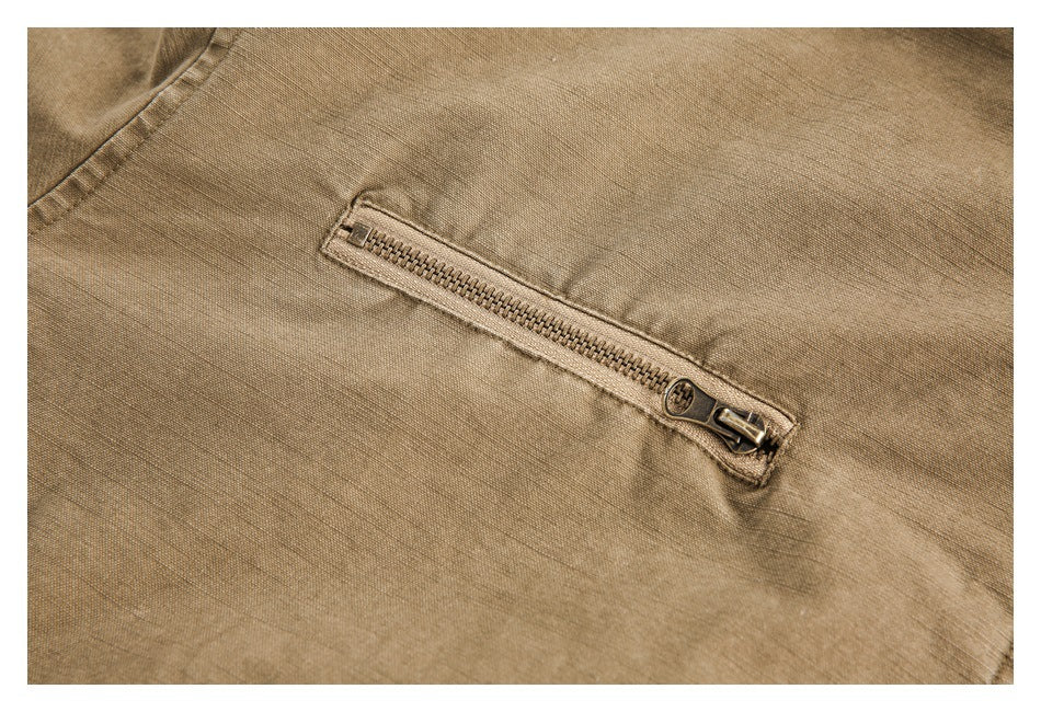 Close-up of a horizontal zipper pocket on tan fabric.