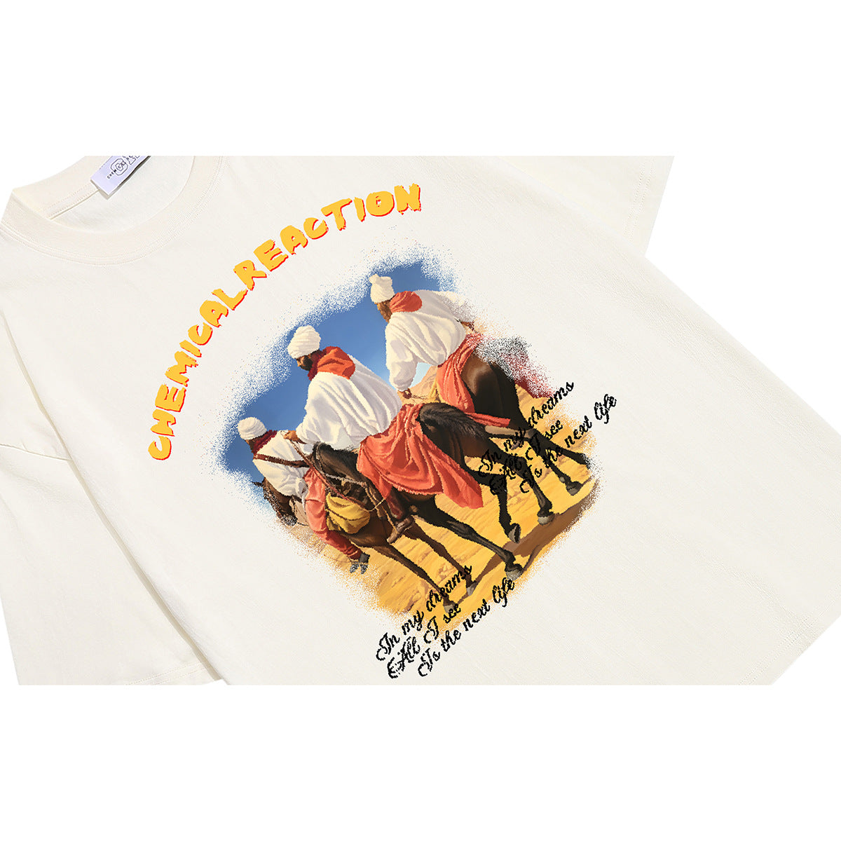 Angled close-up of an off-white T-shirt printed with riders on horseback and colorful lettering.
