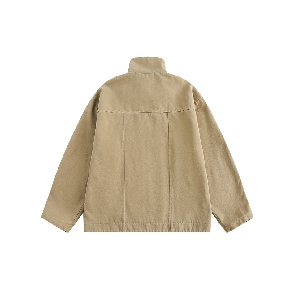 Back view of a plain tan jacket with a stand collar, long sleeves, and visible seam panels.