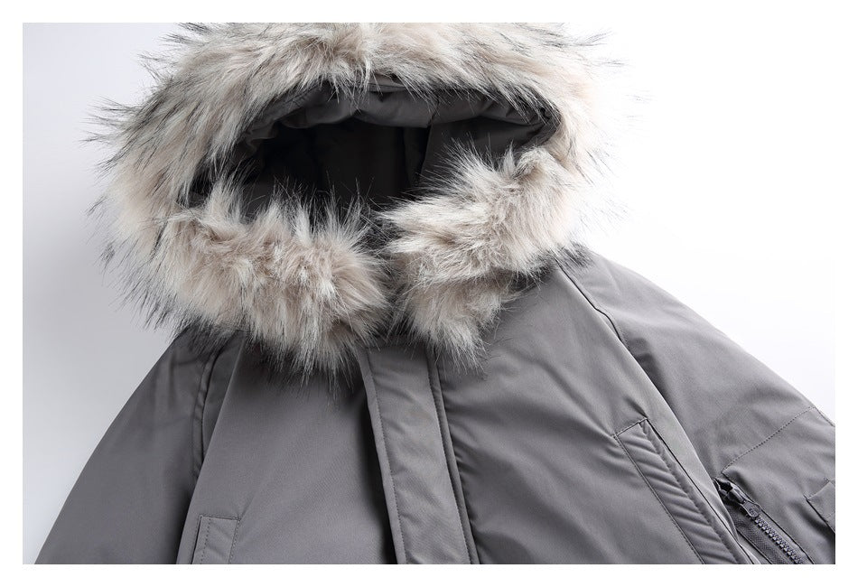 Close-up of a charcoal-gray jacket hood trimmed with light gray faux fur.