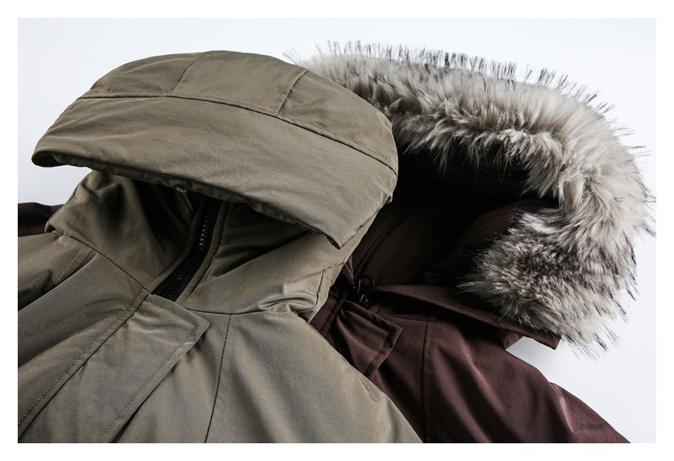 Close-up of gray-brown and plum jacket hoods, showing contrasting fur trim and hood construction.