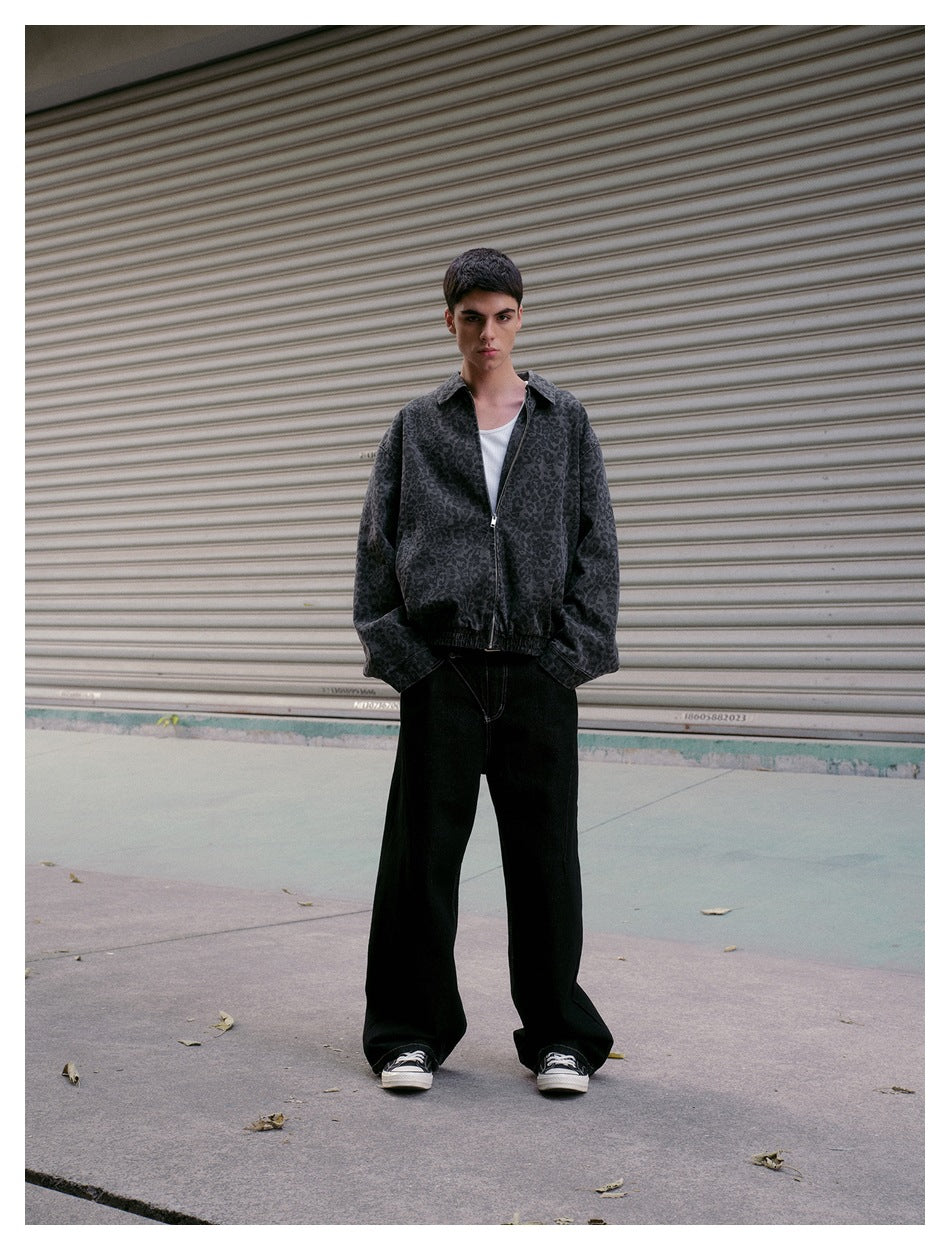 Full-length view of a person in a leopard-print zip jacket, white tank top, wide black pants and sneakers