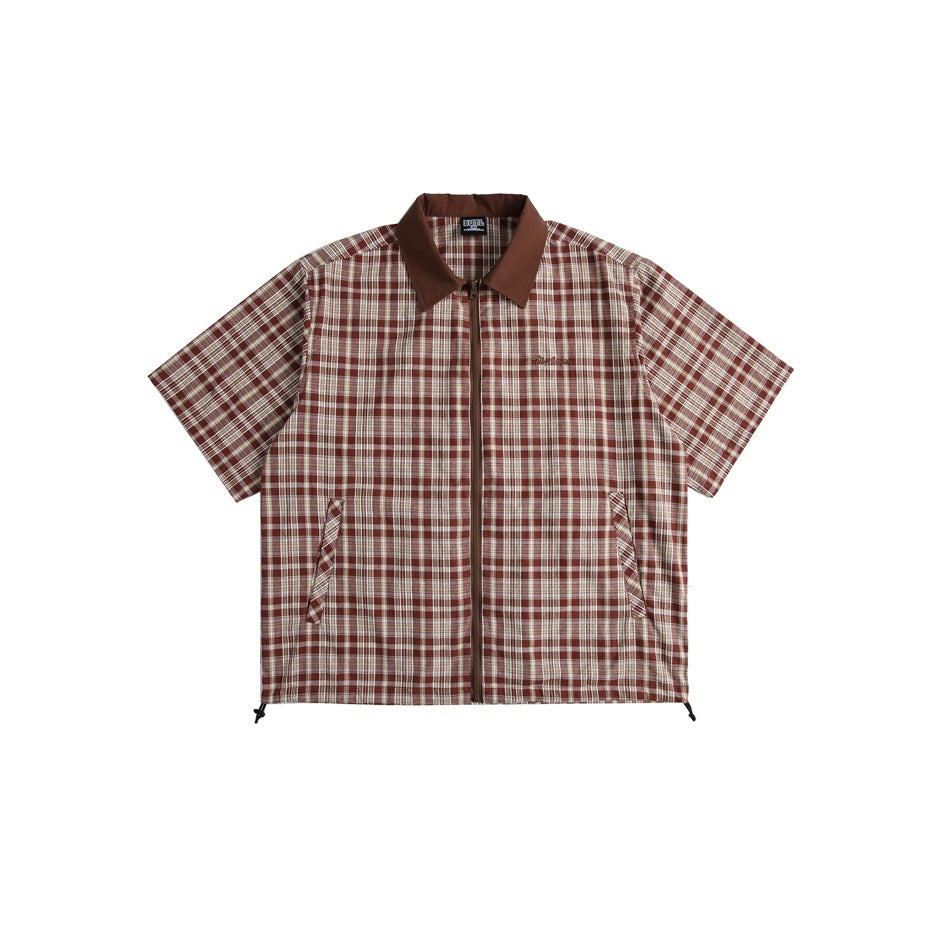 Brown plaid short-sleeve zip-front shirt with brown collar, slanted pockets and hem drawcords, flat lay