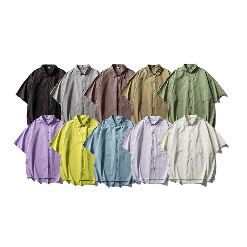 Ten short-sleeve button-front shirts in assorted solid colors arranged in two rows