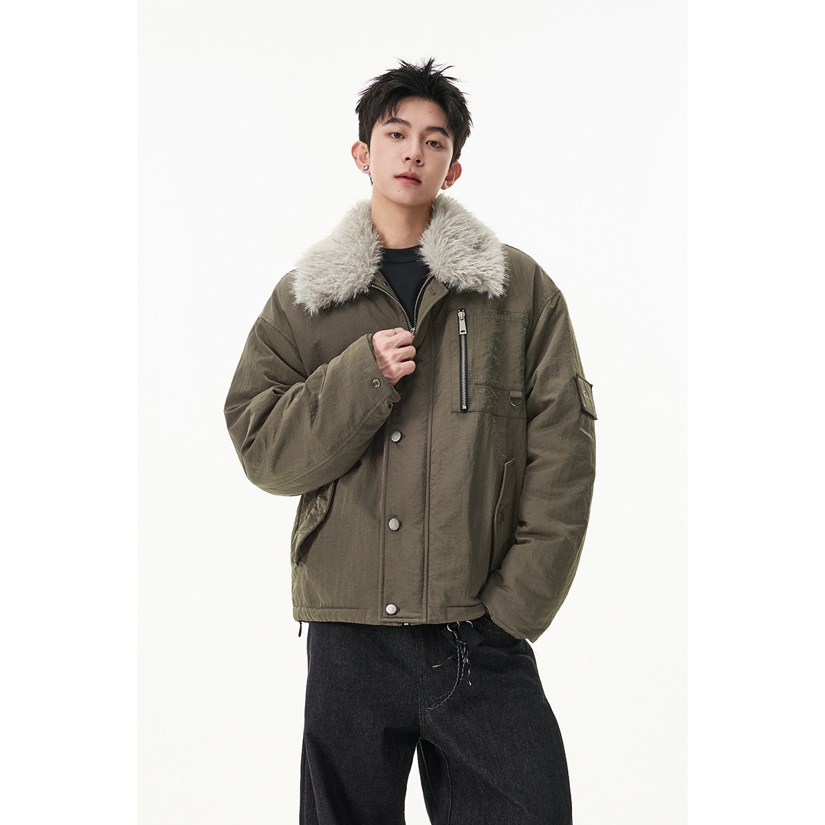 Model wearing an olive-brown jacket with a plush light collar, snap buttons, and zippered chest pocket.
