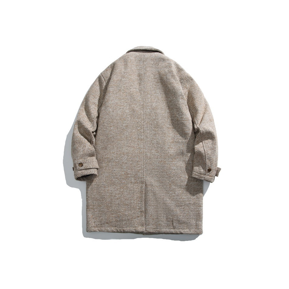 Back view of a beige herringbone coat laid flat, with a collar and buttoned sleeve tabs.