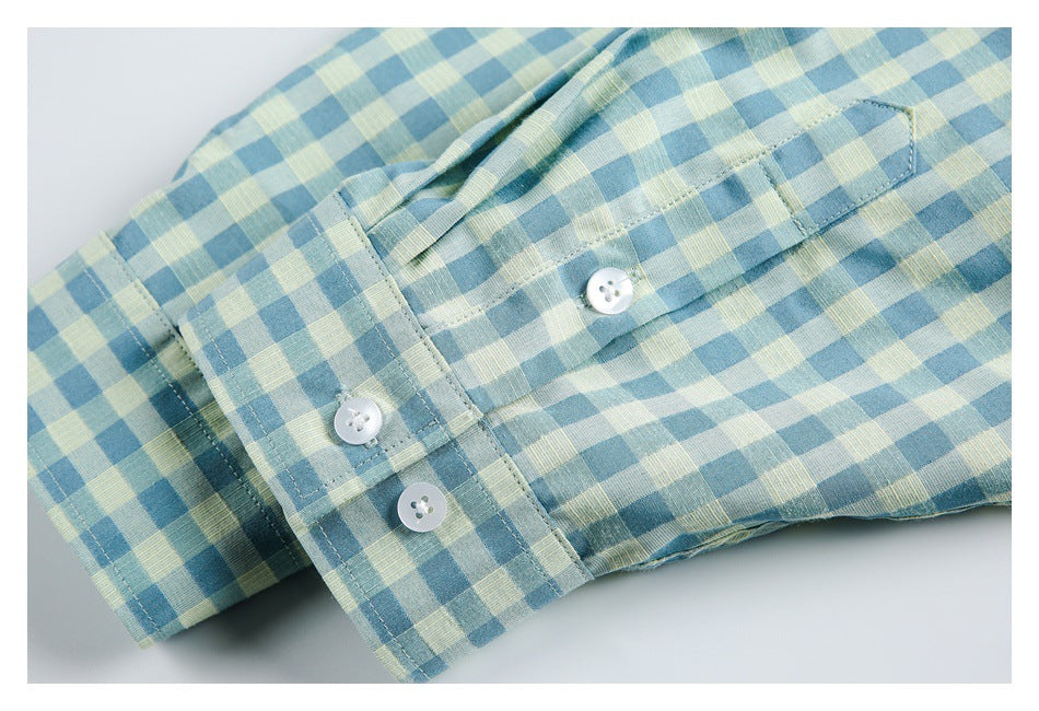 Close-up of the shirt's buttoned cuff and sleeve in blue and pale yellow gingham.