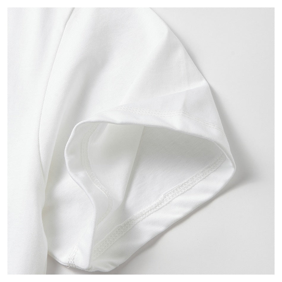 Close-up of a white short sleeve showing its opening and inner seam stitching.