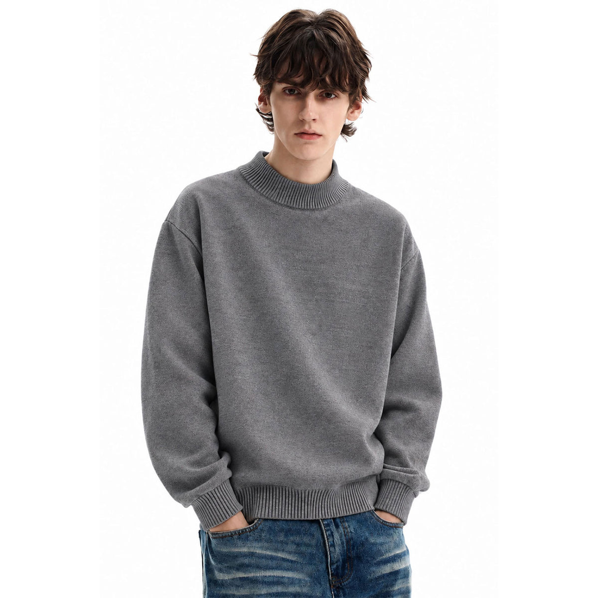 Model wearing a gray sweater with a high ribbed neckline, cuffs, and hem.