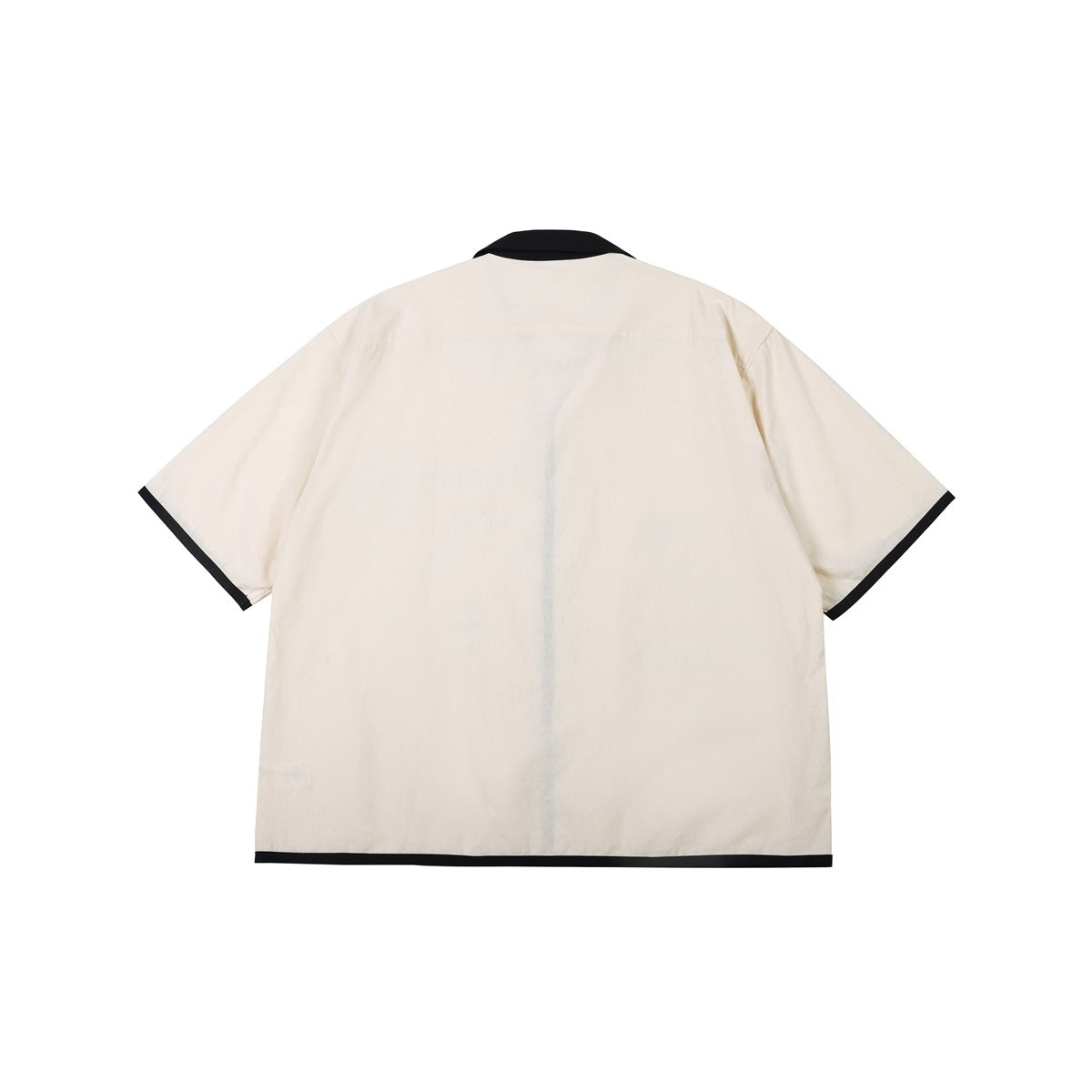 Back view of a cream short-sleeve shirt with black collar and black trim at the cuffs and hem.