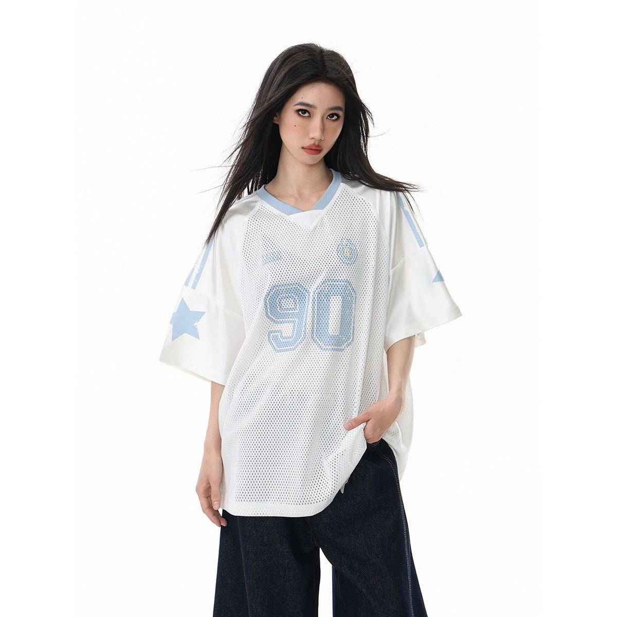 Model wearing a white mesh jersey with pale blue trim, star sleeve graphics and a large number 90 on the front.