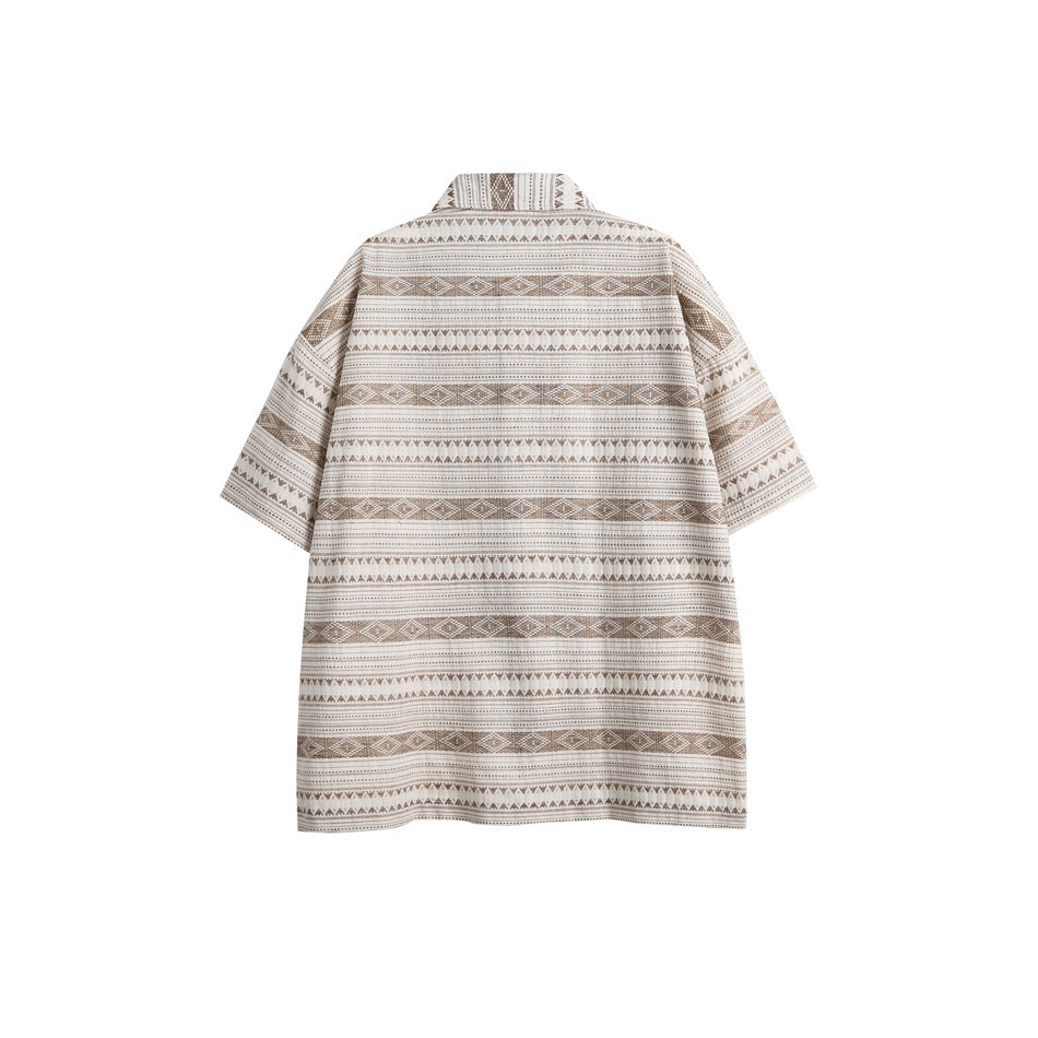 Back view of an oversized short-sleeve shirt with horizontal beige geometric stripes on an off-white base.