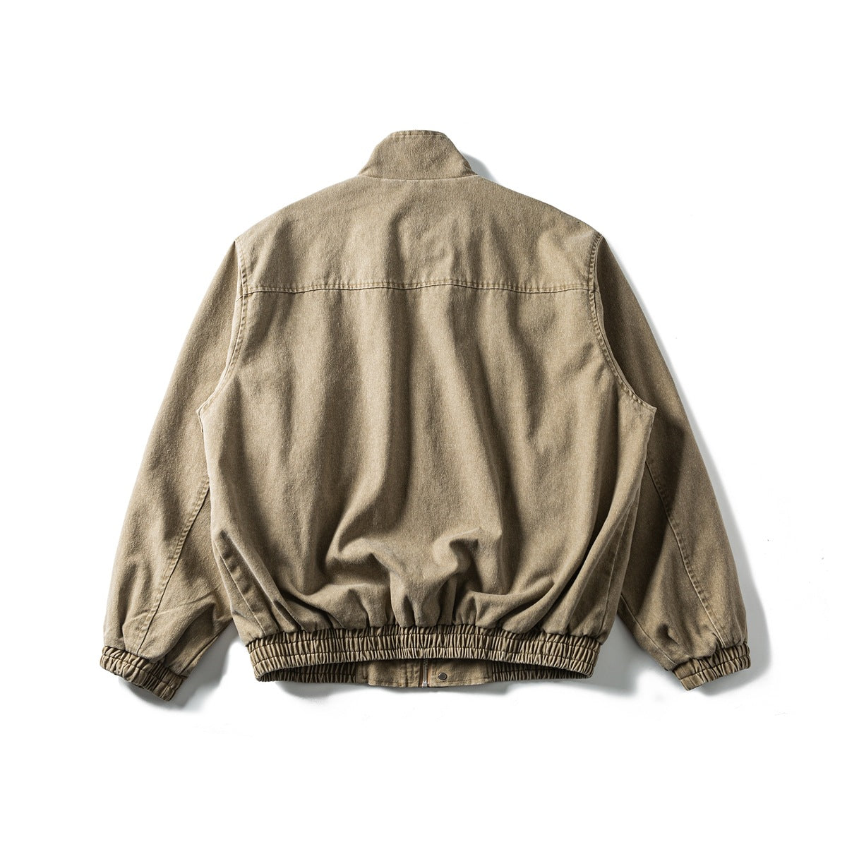 Back view of a tan stand-collar jacket with long sleeves and a gathered elastic hem and cuffs.
