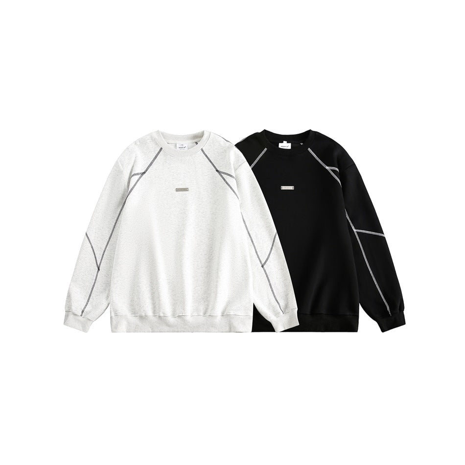 Two sweatshirts shown side by side: one light gray and one black, both with contrast seam detailing.