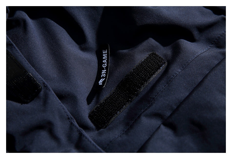 Close-up of a sewn English label and hook-and-loop fastening on the jacket.