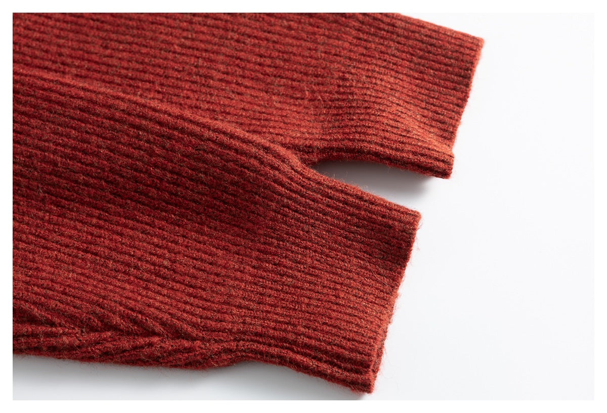 Close-up of rust-red rib-knit sleeve cuffs with a thick, fuzzy texture.
