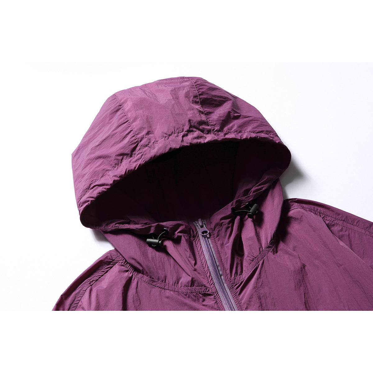 Close-up of the plum jacket's hood, drawcords, and front zipper.