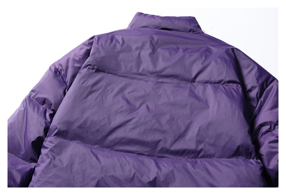 Cropped rear view of a purple jacket showing its collar, shoulders, sleeves, and horizontal quilted panels.