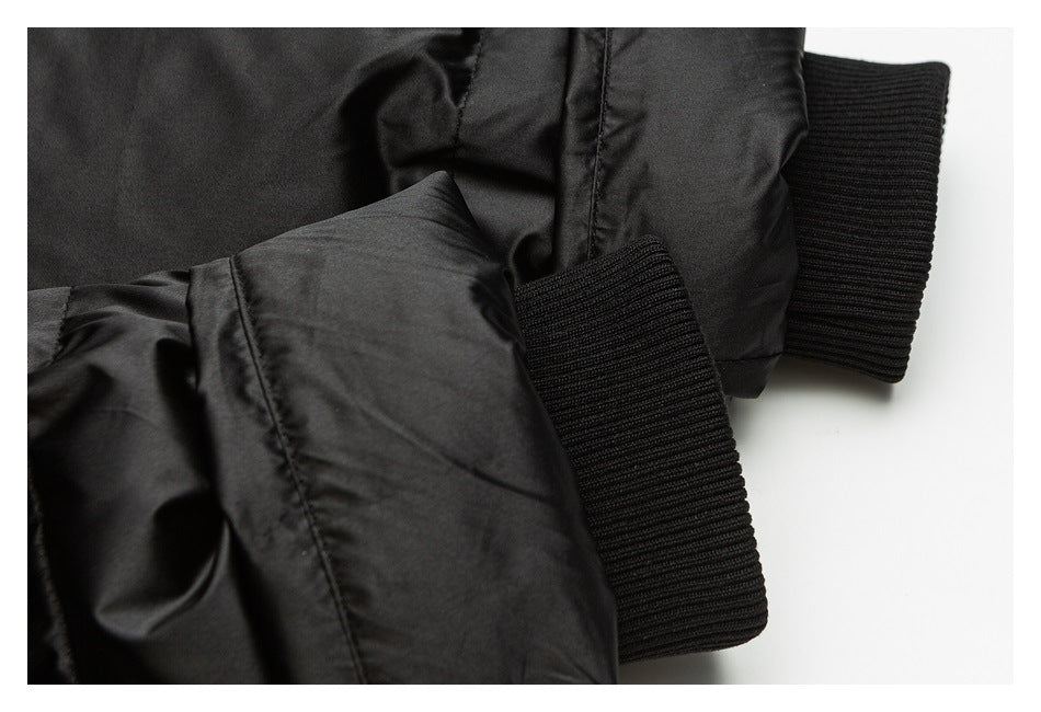 Close-up of the black jacket sleeve and ribbed cuff.