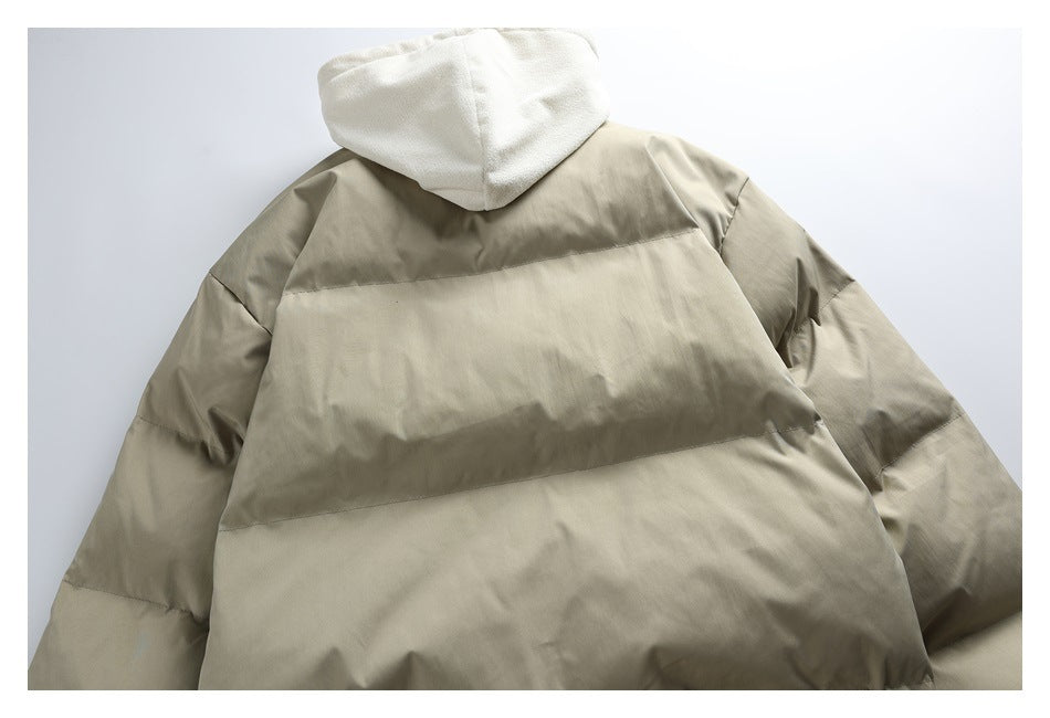 Back view of a taupe puffer jacket with a cream hood and horizontal panels.