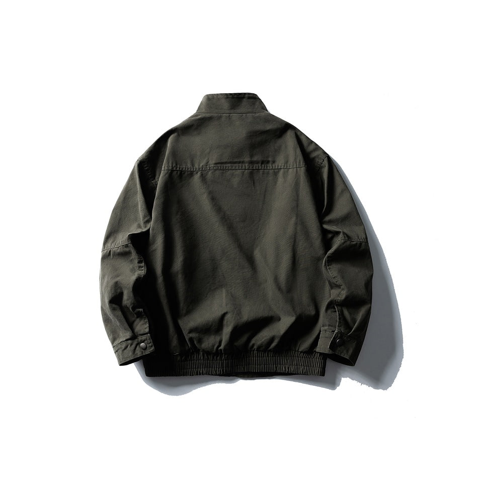 Back view of army green stand-collar jacket flat lay with yoke seam, snap cuff tabs and elastic ribbed hem