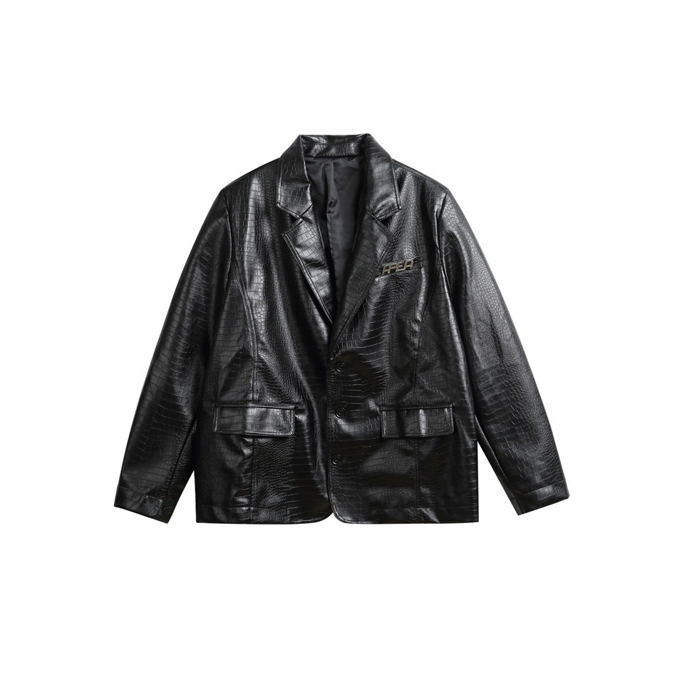 Black crocodile-embossed blazer-style jacket with notch lapels, two buttons and flap pockets, flat front view