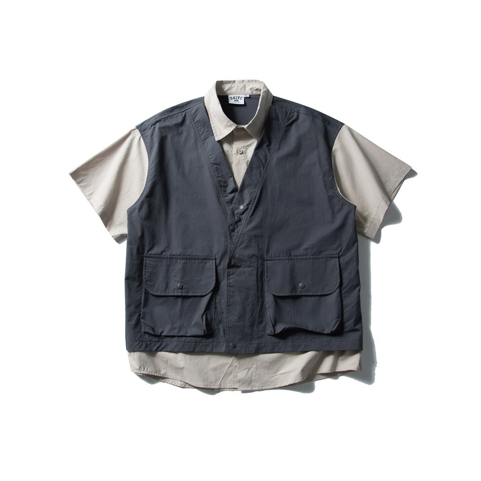 Navy vest-style layered short-sleeve shirt with beige sleeves, collar and two large snap flap pockets, flat lay