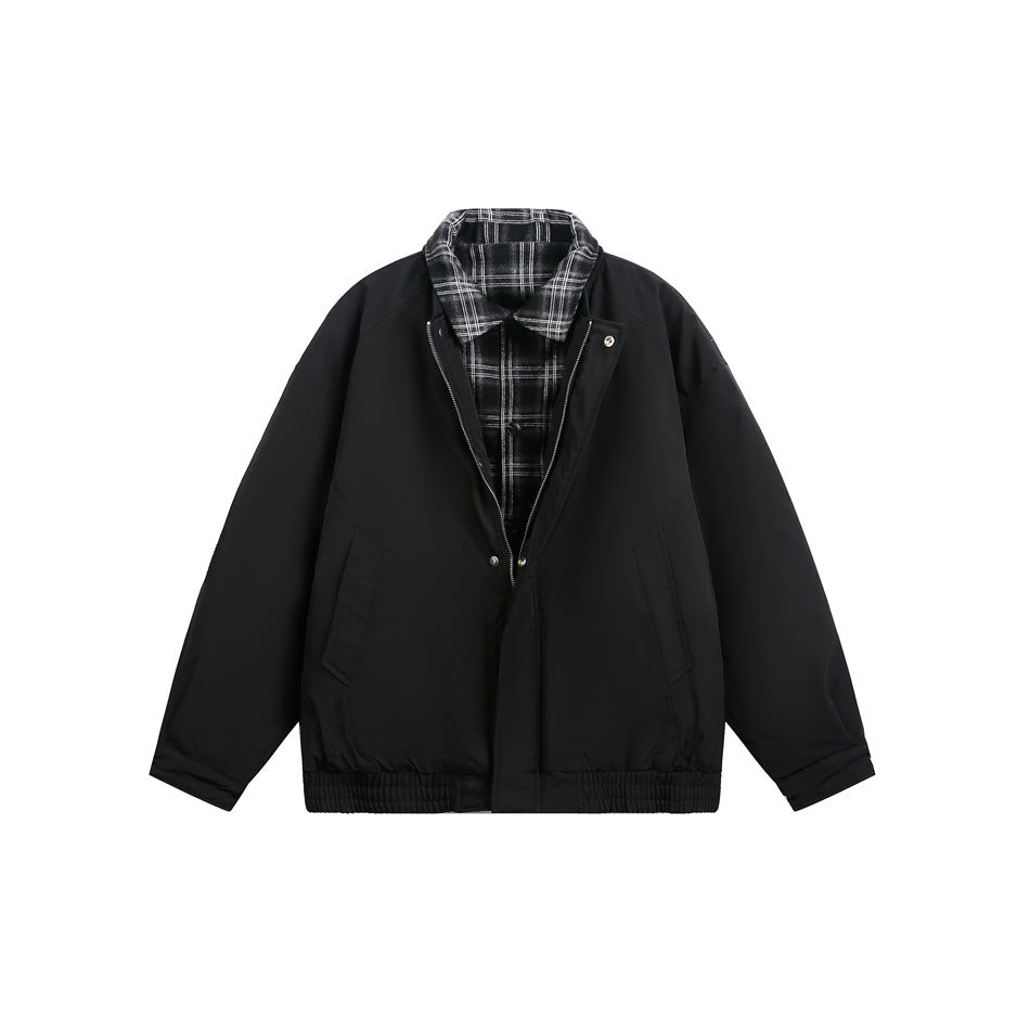Black bomber-style jacket flat lay with plaid collar and placket layer under the zip front, pockets and elastic hem