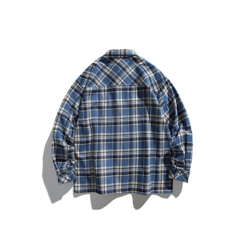 Back view of blue plaid long-sleeve shirt showing back yoke seam and button cuffs