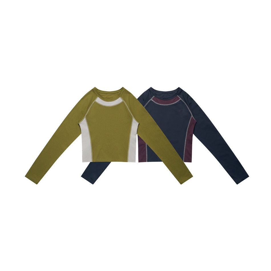 Two long-sleeve cropped tops shown from the front: olive with white panels and navy with burgundy panels.