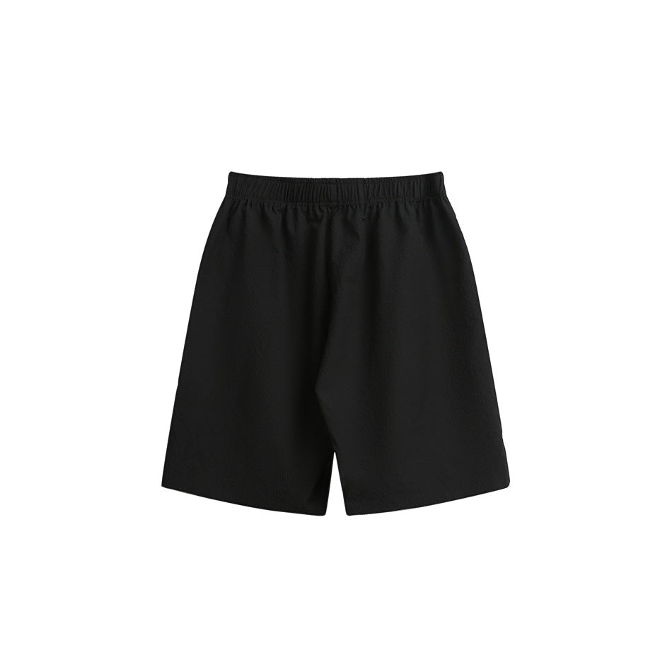 Black knee-length shorts shown flat against a white background, with a wide elastic waistband.