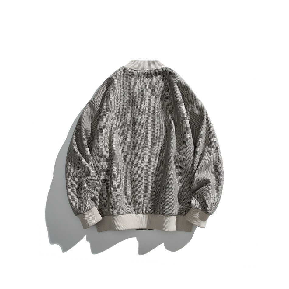 Back view of a gray herringbone bomber jacket with white ribbed collar, cuffs and hem.