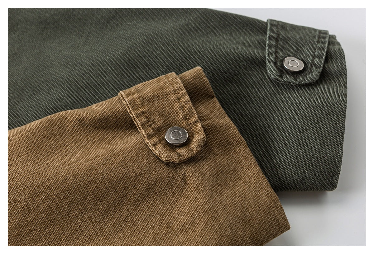 Close-up of snap-tab cuffs on dark olive and brown jackets.