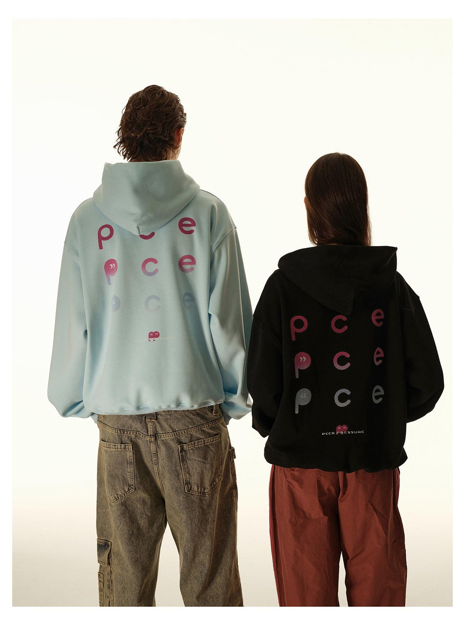 Two models show the backs of pale blue and black hoodies with colorful graphic lettering.